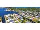 Expansive aerial view of a waterfront home with boating access and gorgeous water views at 5425 Bluepoint Dr, Port Richey, FL 34668