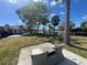 A serene backyard setting with outdoor seating area under the trees, providing a peaceful retreat at 5425 Bluepoint Dr, Port Richey, FL 34668