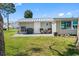 A delightful backyard featuring a patio with seating and a grill, perfect for outdoor relaxation and entertainment at 5425 Bluepoint Dr, Port Richey, FL 34668