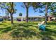 Large backyard with lounge chairs overlooking the canal at 5425 Bluepoint Dr, Port Richey, FL 34668