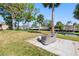 Backyard area features a patio with comfortable seating perfect for enjoying the tranquil surroundings at 5425 Bluepoint Dr, Port Richey, FL 34668