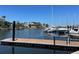 Modern boat dock with sturdy wood construction and secure fencing along a deep water canal at 5425 Bluepoint Dr, Port Richey, FL 34668