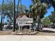 Welcome to the City of Port Richey sign at Nick's Park with palm trees and lush greenery at 5425 Bluepoint Dr, Port Richey, FL 34668