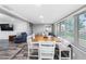 Open concept dining area with a spacious table and seating for six at 5425 Bluepoint Dr, Port Richey, FL 34668