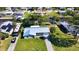 Beautifully landscaped home featuring modern upgrades, lush green lawn, and waterfront access at 5425 Bluepoint Dr, Port Richey, FL 34668