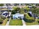 Charming single-story home featuring a metal roof, well-maintained lawn, and a paved driveway, perfect for suburban living at 5425 Bluepoint Dr, Port Richey, FL 34668