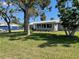 Charming home with well-maintained lawn and landscaping at 5425 Bluepoint Dr, Port Richey, FL 34668