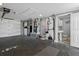 Spacious garage with laundry area and access to bathroom at 5425 Bluepoint Dr, Port Richey, FL 34668