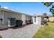 Paver patio offers an outdoor living space with room for entertaining and relaxing at 5425 Bluepoint Dr, Port Richey, FL 34668
