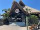 Quaint waterfront restaurant with tiki-style architecture and welcoming entrance at 5425 Bluepoint Dr, Port Richey, FL 34668