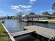 Picturesque waterfront view showcasing a boat dock and serene canal at 5425 Bluepoint Dr, Port Richey, FL 34668