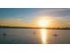 Picture of a beautiful sunset from the water with distant views of kayakers at 5425 Bluepoint Dr, Port Richey, FL 34668