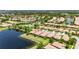 A community boasting beautiful homes with tile roofs and a tranquil lake view at 5728 Sunset Falls Dr, Apollo Beach, FL 33572