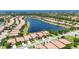 Beautiful aerial view of a residential community with a lake and well-maintained landscaping at 5728 Sunset Falls Dr, Apollo Beach, FL 33572