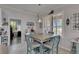 Dining area featuring plantation shutters and a view of the kitchen at 5728 Sunset Falls Dr, Apollo Beach, FL 33572