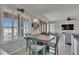 Dining area with natural light from shuttered windows, adjacent to kitchen at 5728 Sunset Falls Dr, Apollo Beach, FL 33572