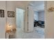 Bright hallway that leads to the guest bedroom and office with tile floors at 5728 Sunset Falls Dr, Apollo Beach, FL 33572