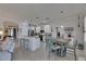 Bright, airy kitchen with an island, stainless appliances, and a casual dining area at 5728 Sunset Falls Dr, Apollo Beach, FL 33572