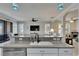 Kitchen island with sink, stainless steel dishwasher, and living area view at 5728 Sunset Falls Dr, Apollo Beach, FL 33572