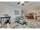 Cozy living room with tile floors, a fireplace, and an abundance of natural light at 5728 Sunset Falls Dr, Apollo Beach, FL 33572