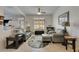 Cozy living room with tile floors, a fireplace, and an abundance of natural light at 5728 Sunset Falls Dr, Apollo Beach, FL 33572