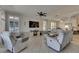Inviting living room featuring comfortable seating and a large television for entertainment at 5728 Sunset Falls Dr, Apollo Beach, FL 33572