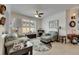 Cozy living room with tile floors, a fireplace, and an abundance of natural light at 5728 Sunset Falls Dr, Apollo Beach, FL 33572
