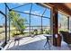 Enjoy the serene lake views from the patio with potted plants, tables, and cozy seating at 5728 Sunset Falls Dr, Apollo Beach, FL 33572