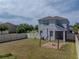 Backyard featuring a patio with a fire pit, a white fence, and a screened lanai at 6222 Trent Creek Dr, Sun City Center, FL 33573