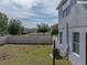 Fenced backyard offering privacy and space, with string lights adding ambiance, and ample room for outdoor activities at 6222 Trent Creek Dr, Sun City Center, FL 33573