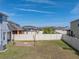 Expansive backyard featuring a fire pit area, string lights, and privacy fencing, providing a perfect outdoor retreat at 6222 Trent Creek Dr, Sun City Center, FL 33573