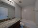 Neat bathroom with granite countertop sink, and a bathtub and shower combination at 6222 Trent Creek Dr, Sun City Center, FL 33573