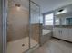 Bathroom showcasing a tiled shower, a soaking tub, and a vanity with modern fixtures at 6222 Trent Creek Dr, Sun City Center, FL 33573