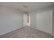 Bright bedroom featuring soft gray walls, plush carpeting and double door closet at 6222 Trent Creek Dr, Sun City Center, FL 33573