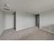 Spacious bedroom with soft gray walls and carpet with view of entry hallway at 6222 Trent Creek Dr, Sun City Center, FL 33573