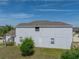 Side view of the house showing stucco exterior, lawn, and well-kept landscaping at 6222 Trent Creek Dr, Sun City Center, FL 33573