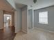Open hallway showcasing tile and hardwood floors, with access to multiple rooms and ample lighting at 6222 Trent Creek Dr, Sun City Center, FL 33573