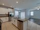 Open kitchen with a granite island, stainless steel appliances, and ample cabinet space at 6222 Trent Creek Dr, Sun City Center, FL 33573