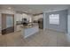 Open-concept kitchen features granite countertops, stainless appliances, and ample natural light at 6222 Trent Creek Dr, Sun City Center, FL 33573