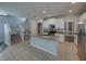 Bright kitchen features granite countertops, stainless steel appliances, and a view of the stairs at 6222 Trent Creek Dr, Sun City Center, FL 33573