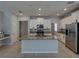 Bright kitchen features granite countertops, stainless steel appliances, and a large island at 6222 Trent Creek Dr, Sun City Center, FL 33573