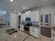 Bright kitchen features granite countertops, stainless steel appliances, and an island sink at 6222 Trent Creek Dr, Sun City Center, FL 33573