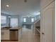 Open-concept kitchen flows into a dining and living area with granite counters and stainless appliances at 6222 Trent Creek Dr, Sun City Center, FL 33573