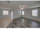 Living room with hardwood floors, a ceiling fan, and natural light near a dining room at 6222 Trent Creek Dr, Sun City Center, FL 33573