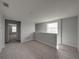 Open loft area with neutral carpet and paint, offering a versatile space for relaxation or entertainment at 6222 Trent Creek Dr, Sun City Center, FL 33573