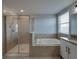 Main bathroom with a tub, a separate shower, and double sinks at 6222 Trent Creek Dr, Sun City Center, FL 33573