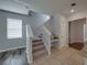 Carpeted staircase features a window for natural light and a built-in desk area at 6222 Trent Creek Dr, Sun City Center, FL 33573