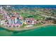 A beautiful aerial shot shows waterfront condos next to a stunning golf course and blue ocean water at 6279 Sun Blvd # 103, St Petersburg, FL 33715