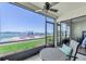 Covered balcony boasts a ceiling fan and views of the pool and waterfront at 6279 Sun Blvd # 103, St Petersburg, FL 33715