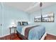 Bedroom with a view out a large window and natural lighting, and hardwood floors at 6279 Sun Blvd # 103, St Petersburg, FL 33715